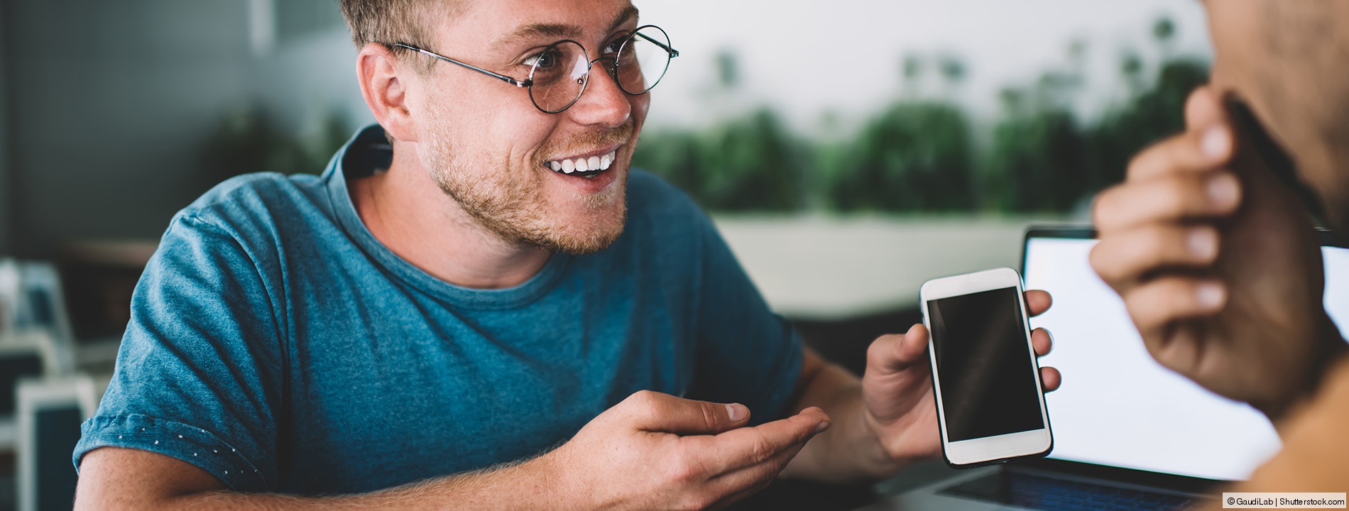 Student holding a smartphone Student holding a smartphone