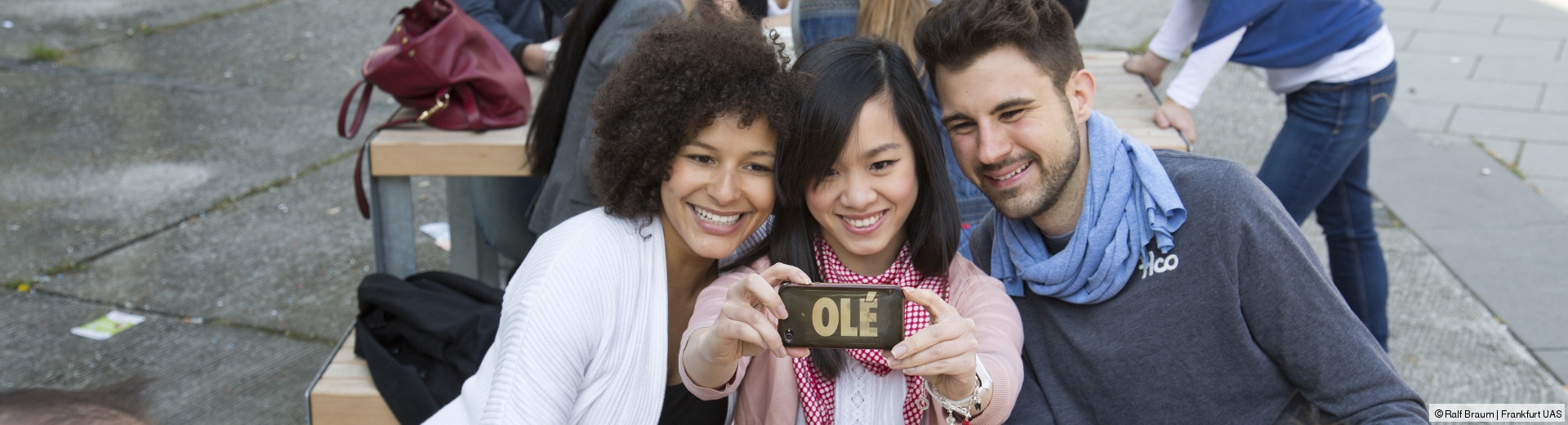 Three students take a selfie.