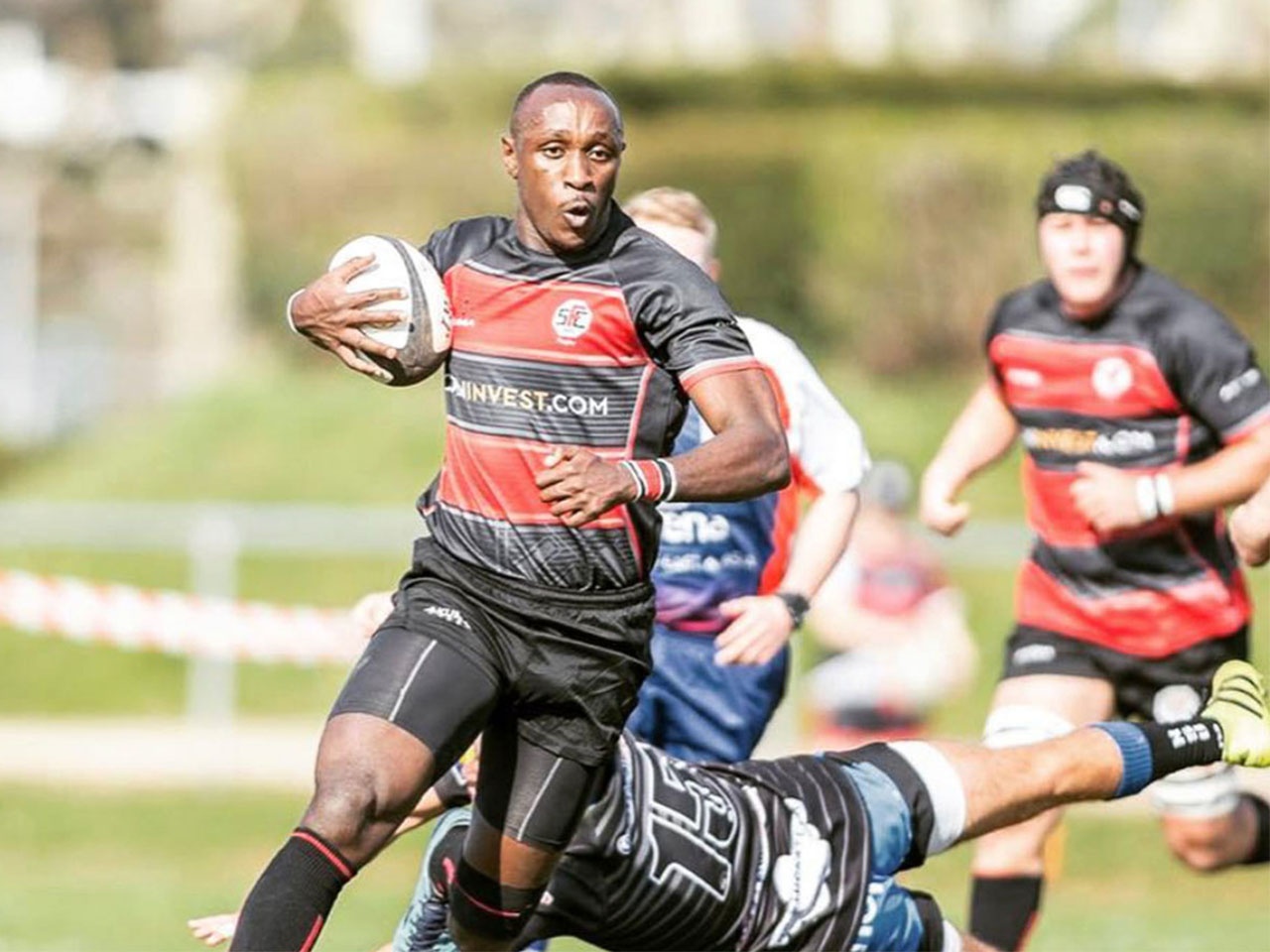 Rugby player Ian Minjire in action